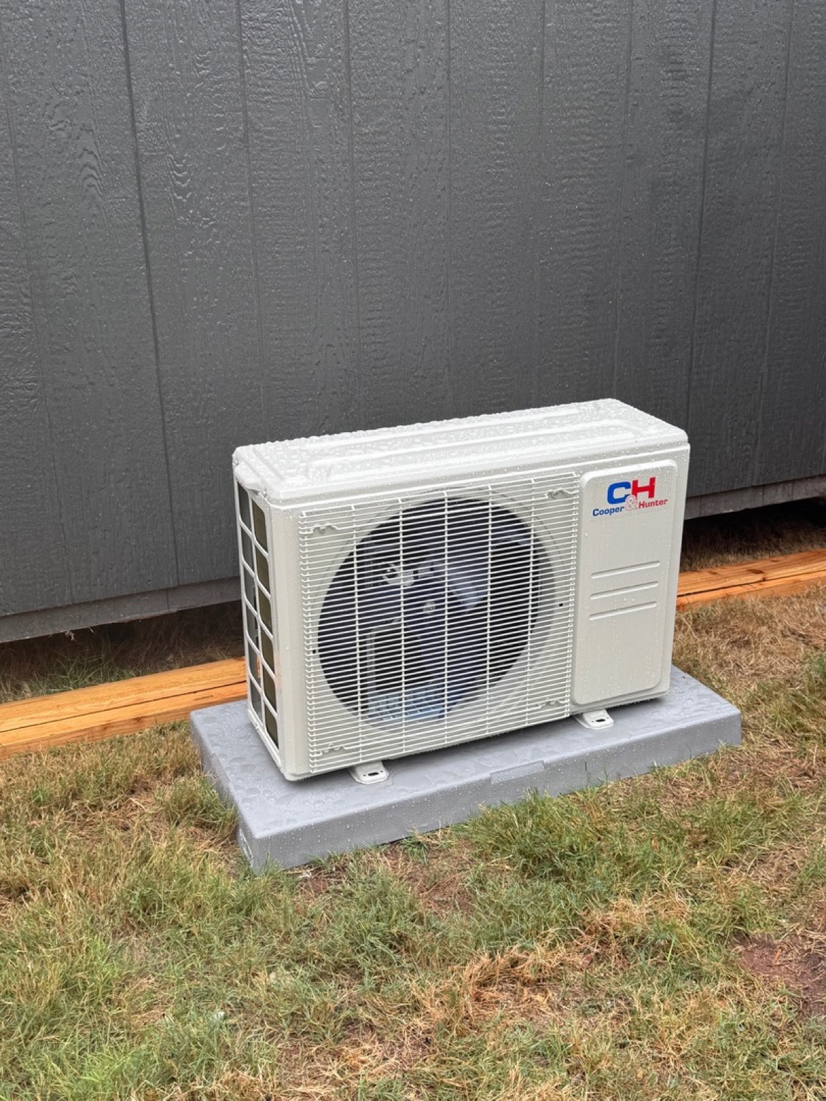 Cooper and Hunter ductless mini-split outdoor condenser on a composite pad installed by Wright Choice near Abilene, TX
