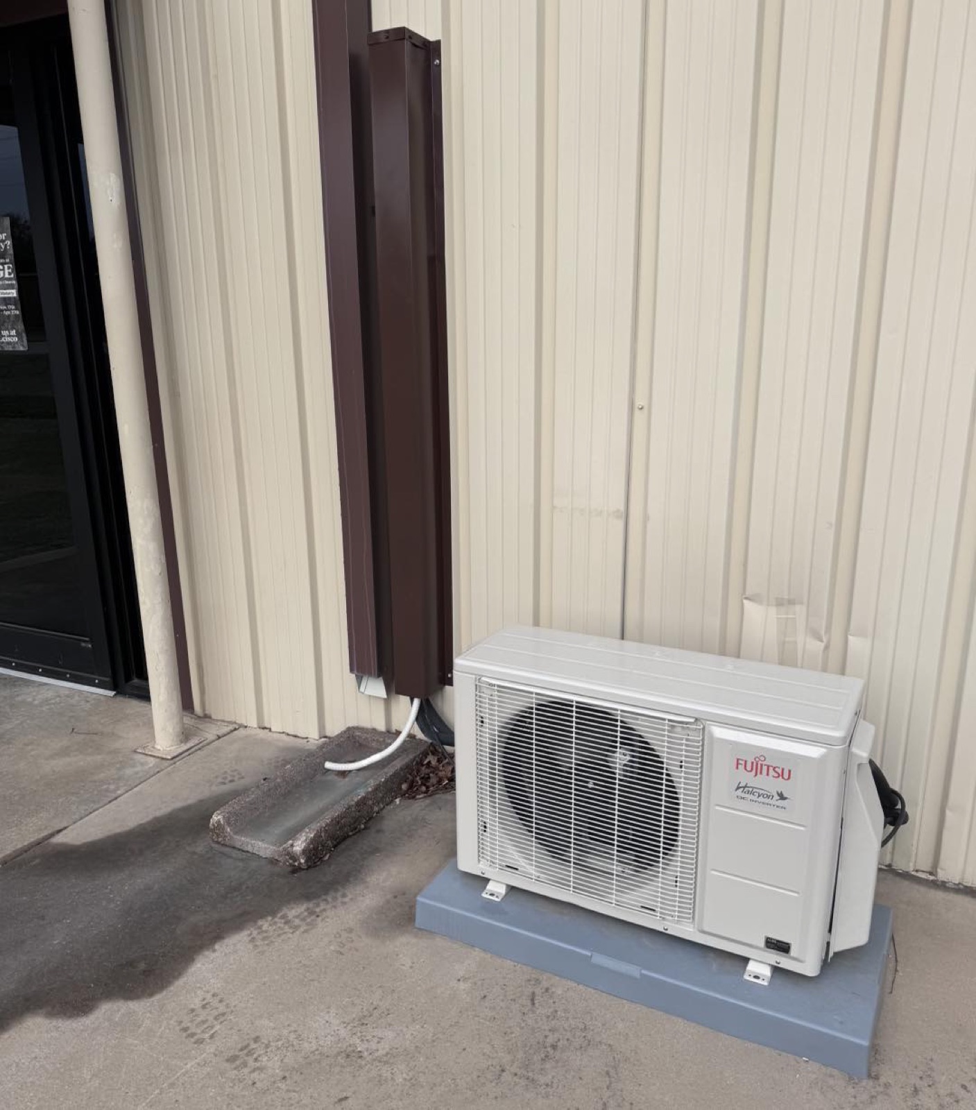 Wright Choice technician servicing an aging heating and cooling system at a Haskell County farm home